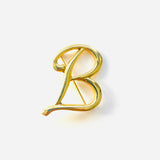 BROCHE B DORADO